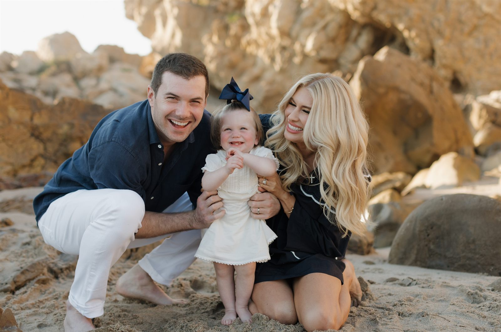Jessie with her husband Andrew and their daughter Harper on the beach